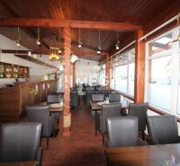 Interior of gastro spaces with brown chairs and a wooden decor floor.