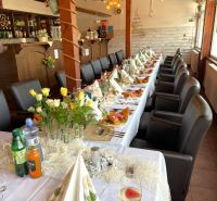 Elegantly set tables with decorations in dining spaces creating a pleasant atmosphere.