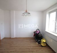Interior of a family house with white walls and a floor with a wood decor.