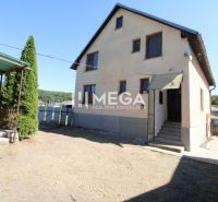 A family house in Nižné Ladičkovce with a garden and outdoor seating.