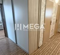 A hallway with wardrobes and entrances to rooms in a 4-room apartment.