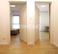 Open door in a 3-room apartment with a wooden decor floor.