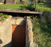 Stone entrance to the cellar on residential plots in the village of Košecké Podhradie.