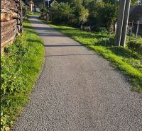 The road between houses in Košecké Podhradie with plots for housing.