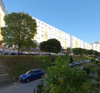 Rozkvet housing estate in Považská Bystrica with apartment buildings and parked cars.