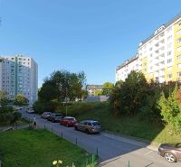 Rozkvet Street, Považská Bystrica, with apartment buildings and parked cars near a 3-room apartment.