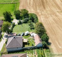 In Pastuchov, there are gardens surrounded by fields and village houses.