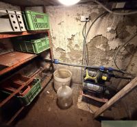 Storage space with shelves and plastic crates in the cabin.