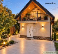 A cottage near Nové Zámky surrounded by greenery and illuminated exterior at dusk.