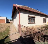 A family house in Hurbanovo with a large fenced garden, an adjacent garage, and a grassy plot.