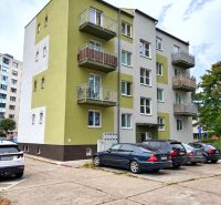 Apartment building on Andrusovova Street, Bratislava - Petržalka with parked cars in front of the building.