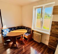 1-bedroom apartment with a corner sofa and flooring with a wood design.