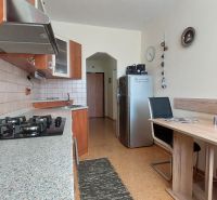Kitchen in a 3-room apartment with a dining table and kitchen unit.