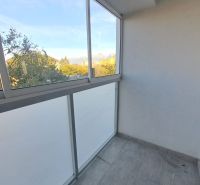 A glazed balcony of a 2-room apartment with a view of the forests in Poprad on Štúrova Street.