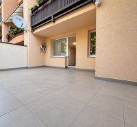 Terrace of a 3-room apartment on Vajanského Street in Trnava with tiles and greenery on the balcony.