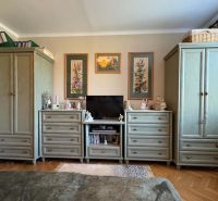 Living room with traditional furniture and decorations in a 3-room apartment.