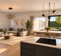 Living room in a family house with a wooden decor floor and large windows to the garden.