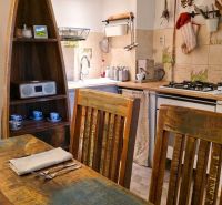 Rustic kitchen in a family house with wooden furniture and decorations.