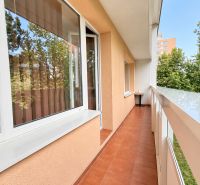 A balcony at a one-room apartment on Bajzova Street in Žilina, with ceramic tiles and a view.