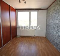 A room with a wooden decor floor and a built-in wardrobe in a 3-room apartment.
