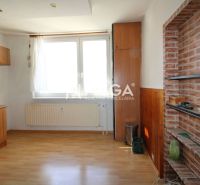 A kitchen with a wood-patterned floor in a 3-room apartment with built-in cabinets.