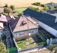 A family house in Kráľový Brod with a garden and nearby neighbors.
