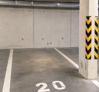 Underground garage with a concrete floor and parking space number 20.