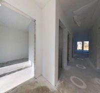 Hallway with white walls and windows in a family house.