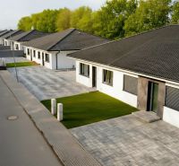 A terraced family house in Hôrka nad Váhom with a paved driveway and a well-maintained lawn.