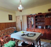 Living room in a family house with wooden decor and furniture.