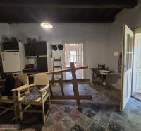 The interior of a family house with simple furnishings and a rustic atmosphere.