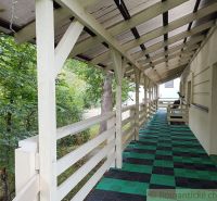 The veranda of a family house in Staškov with greenery and wooden decor.