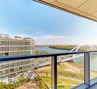 View from a 2-room apartment on Pribinova Street in Bratislava with a bridge and a river.