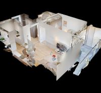 3D floor plan of a 2-room apartment with wood-patterned flooring and furniture.