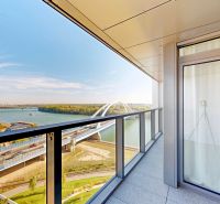 The balcony of a 2-room apartment on Pribinova Street in Bratislava with a view of the river and the bridge.