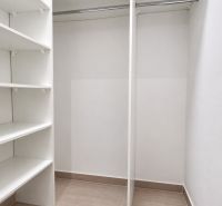 A wardrobe with shelves and a hanging rod in a 2-room apartment.