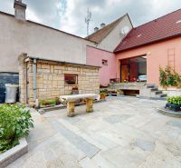 The courtyard of a family house on M. R. Štefánik Street in Holíč with garden decorations.