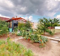 A family house in Holíč on M. R. Štefánika with a landscaped garden and a vegetable bed.