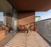 Balcony of apartment construction with seating and a view of Bratislava - Ružinov, Mierová.