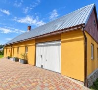 Yellow family house on Košariská Street in Oščadnica with colorful paving.