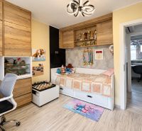 Children's room with wooden decor cabinets and decorations in a family house.