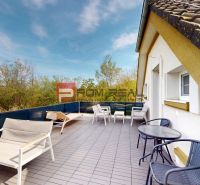 Terrace of a 2-room apartment on Hlavná Street in Miloslavov with comfortable seating.