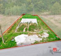 A plot for residential use in Detva with concrete foundations and a grassy surface in a natural environment.