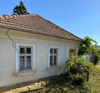 An older house on Štefánikova Street in Krušovce on a plot designated for residential use.
