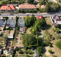 A residential plot on Štefánikova Street in Krušovce with a garden and trees.
