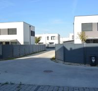 New buildings on Topoľová Street in Rovinka with modern two-story houses.