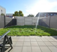 A courtyard for a 3-room apartment on Topoľová Street in Rovinka with a lawn and a terrace.