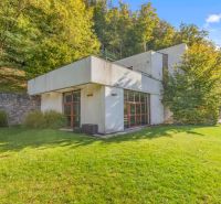A family house on Karpatská Street in Marianka with a well-maintained garden and trees in the surroundings.