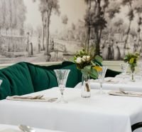 Stylish commercial spaces with rich decor and elegantly set tables.