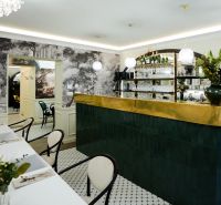 A stylish bar with decorative elements and tables in commercial premises.